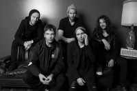 black and white image of current band members.