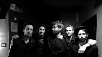 another black and white image of current band members.